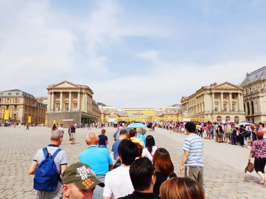 25 of the Best Things to Do in Paris That (Mostly) Won't Break the Bank 31 line of people waiting to get into Versailles Palace