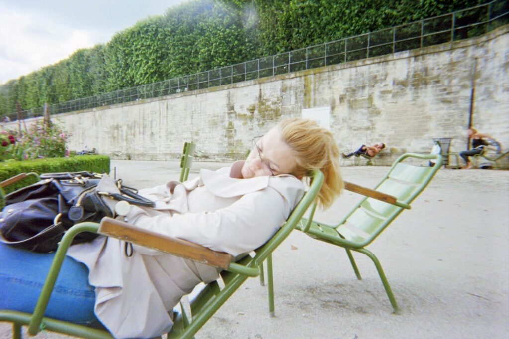 How Many Days in Paris, France? A First-Timer's Planning Guide 5 Woman Napping in Paris Park, What To Do in Paris in 3 Days