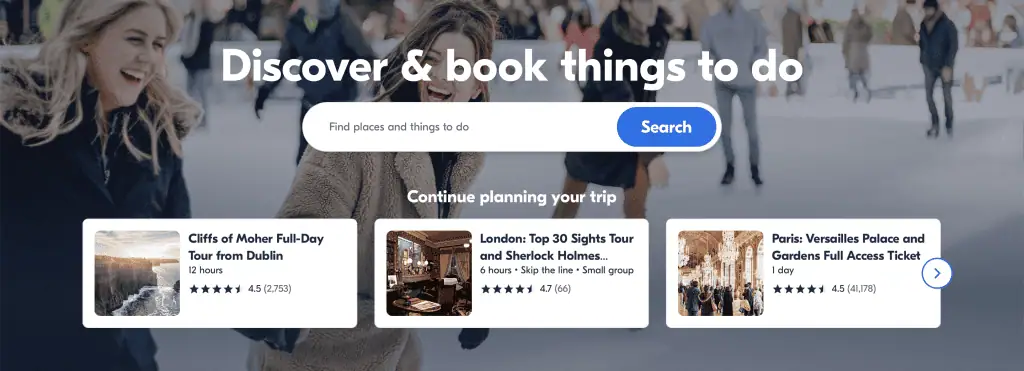 44 Things to Do Before Traveling Internationally + Free Downloadable Checklist 19 GetYourGuide website banner with the text “Discover & book things to do” over a background of people smiling and skating. Below are three featured activities: a Cliffs of Moher full-day tour from Dublin (12 hours, 4.5 stars), a London top sights and Sherlock Holmes tour (6 hours, 4.7 stars), and a Versailles Palace and Gardens full access ticket in Paris (1 day, 4.5 stars).