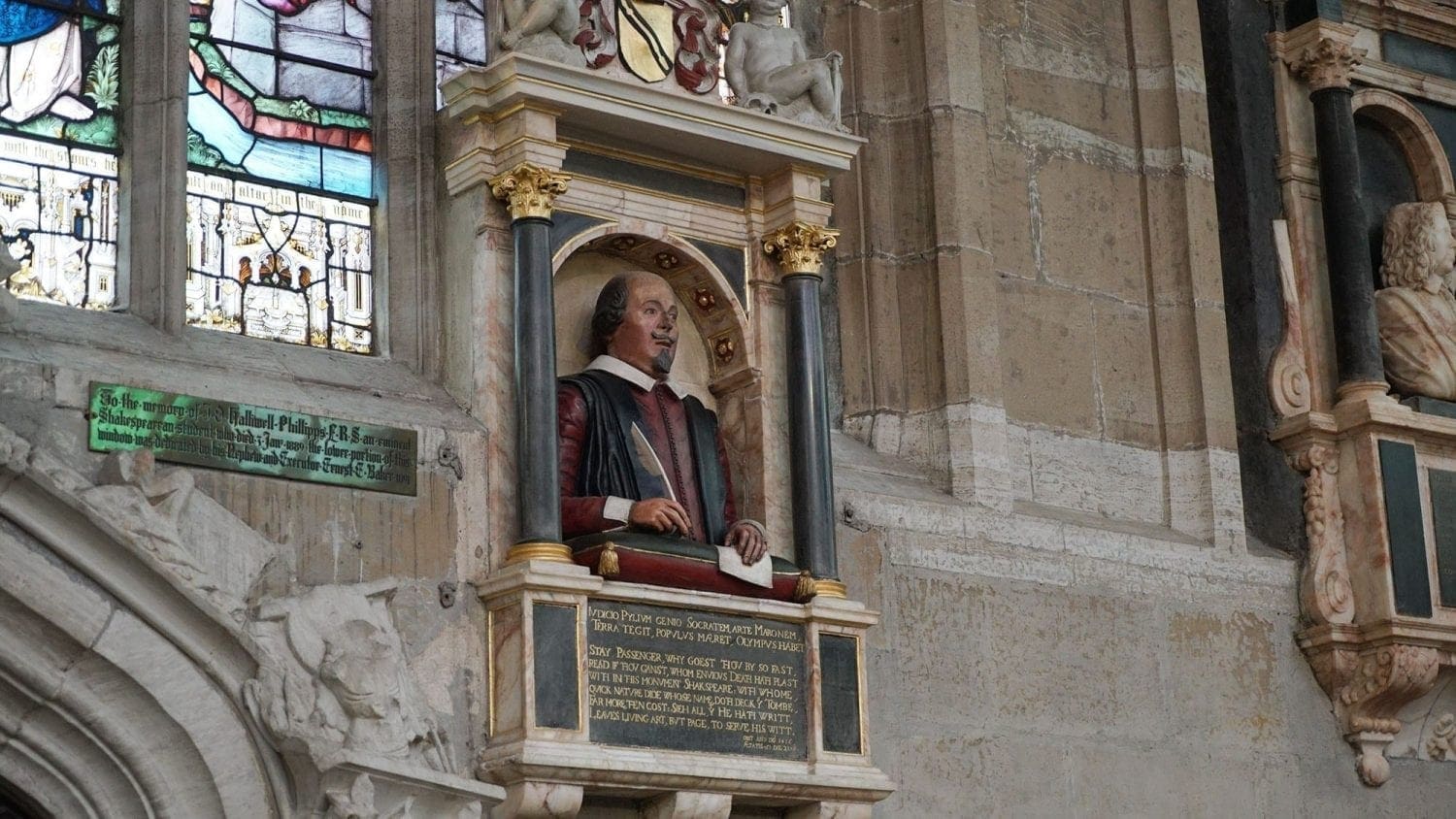 11 Amazing London Day Trips You Can Easily Take by Train in 2 Hours or Less 28 Bust of William Shakespeare inside Holy Trinity Church, Stratford-upon-Avon, mounted above his grave and framed by an arched stone niche. The sculpture commemorates the playwright’s life and legacy in his final resting place.