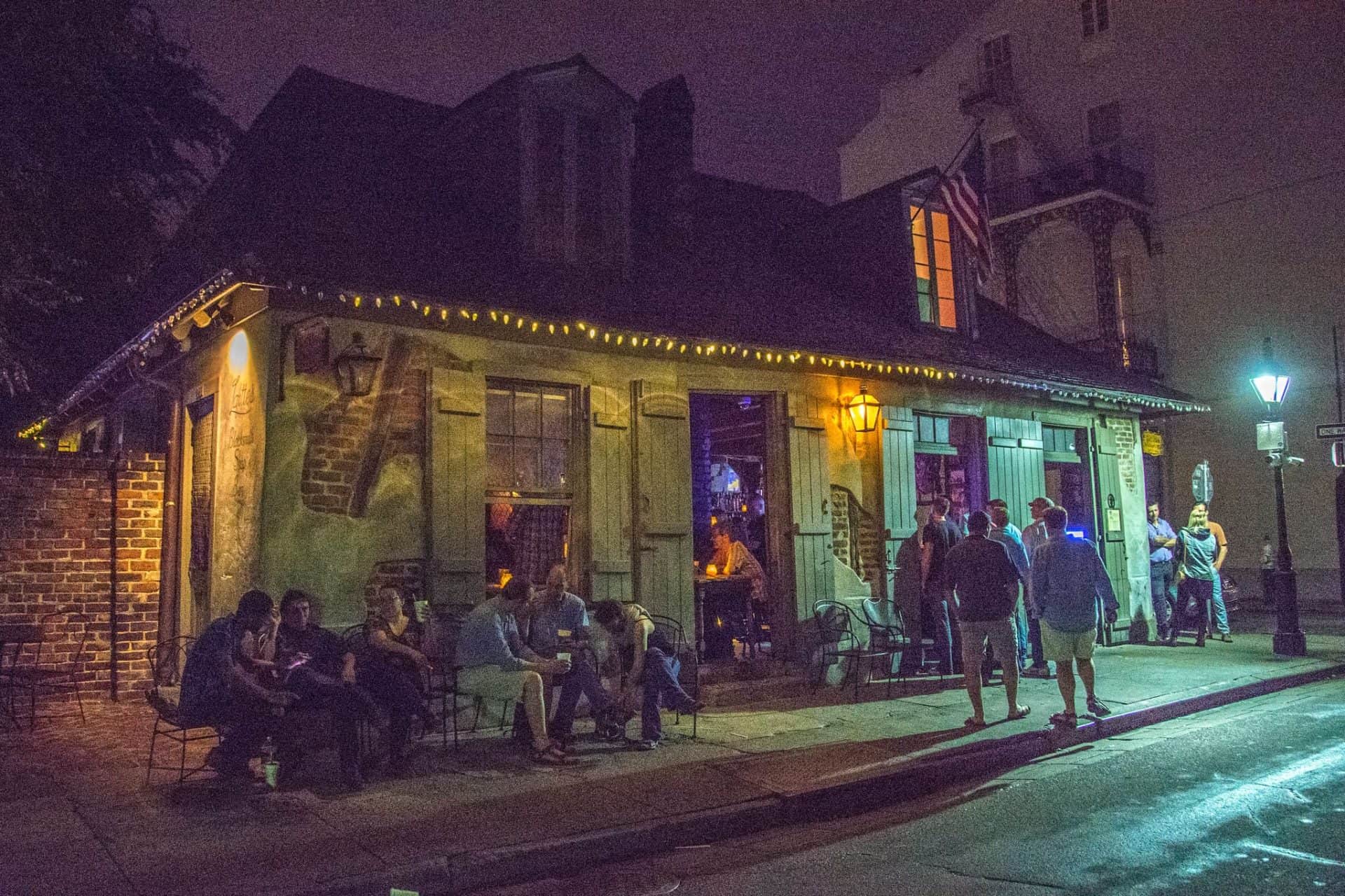 Lafitte's Blacksmith Shop Bar in New Orleans, Louisiana, USA. It's one of the oldest bars in the United States, located on Bourbon Street in the French Quarter. The building dates back to the 18th century and is associated with the pirate Jean Lafitte, who is said to have used it as a base. The dim lighting and historic stone structure give it a famously haunted and atmospheric vibe.