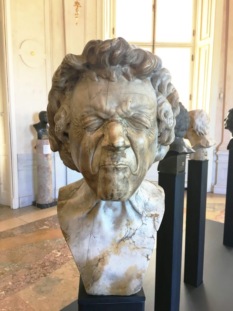 5-Day Austria Travel Itinerary: How to Visit Vienna and Salzburg on a Budget 30 Marble bust from Franz Xaver Messerschmidt’s character head series on display at the Belvedere Palace in Vienna, showing expressive facial features and classical sculpting style.