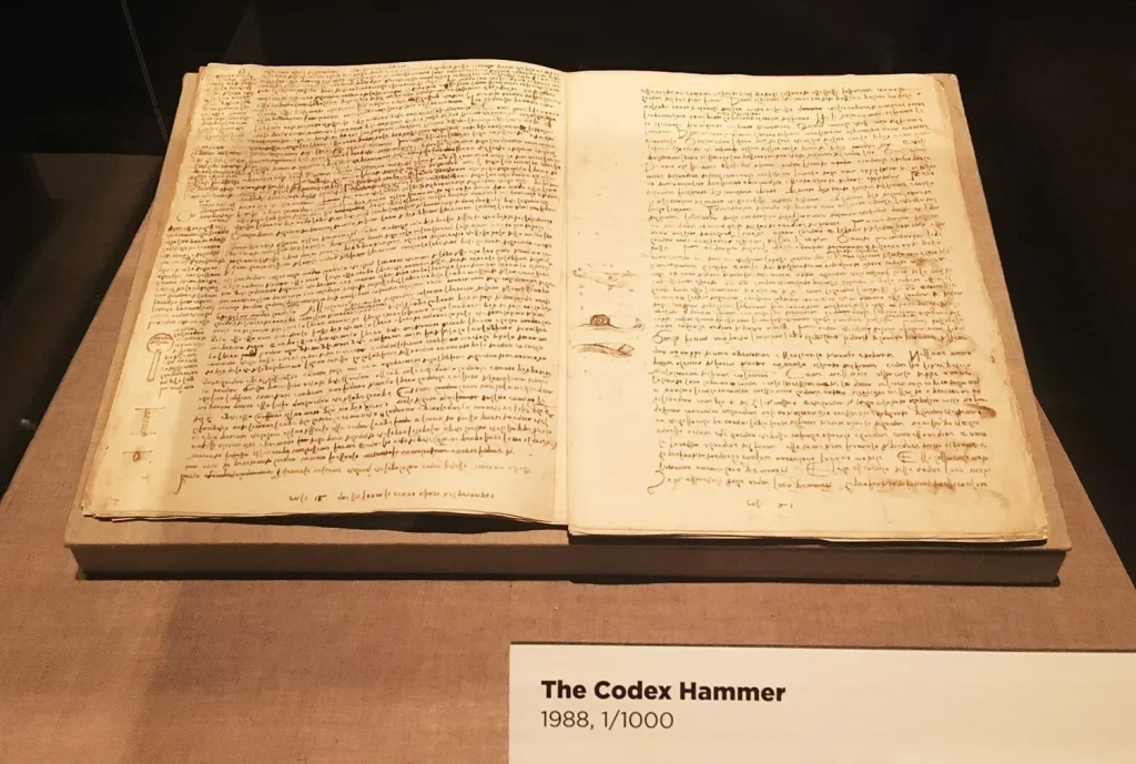 The Leonardo da Vinci Exhibit is Truly Worth It: An Honest Review 4 Display of the Codex Hammer at the Leonardo da Vinci exhibit, an open manuscript with handwritten sketches and notes attributed to the renaissance man.