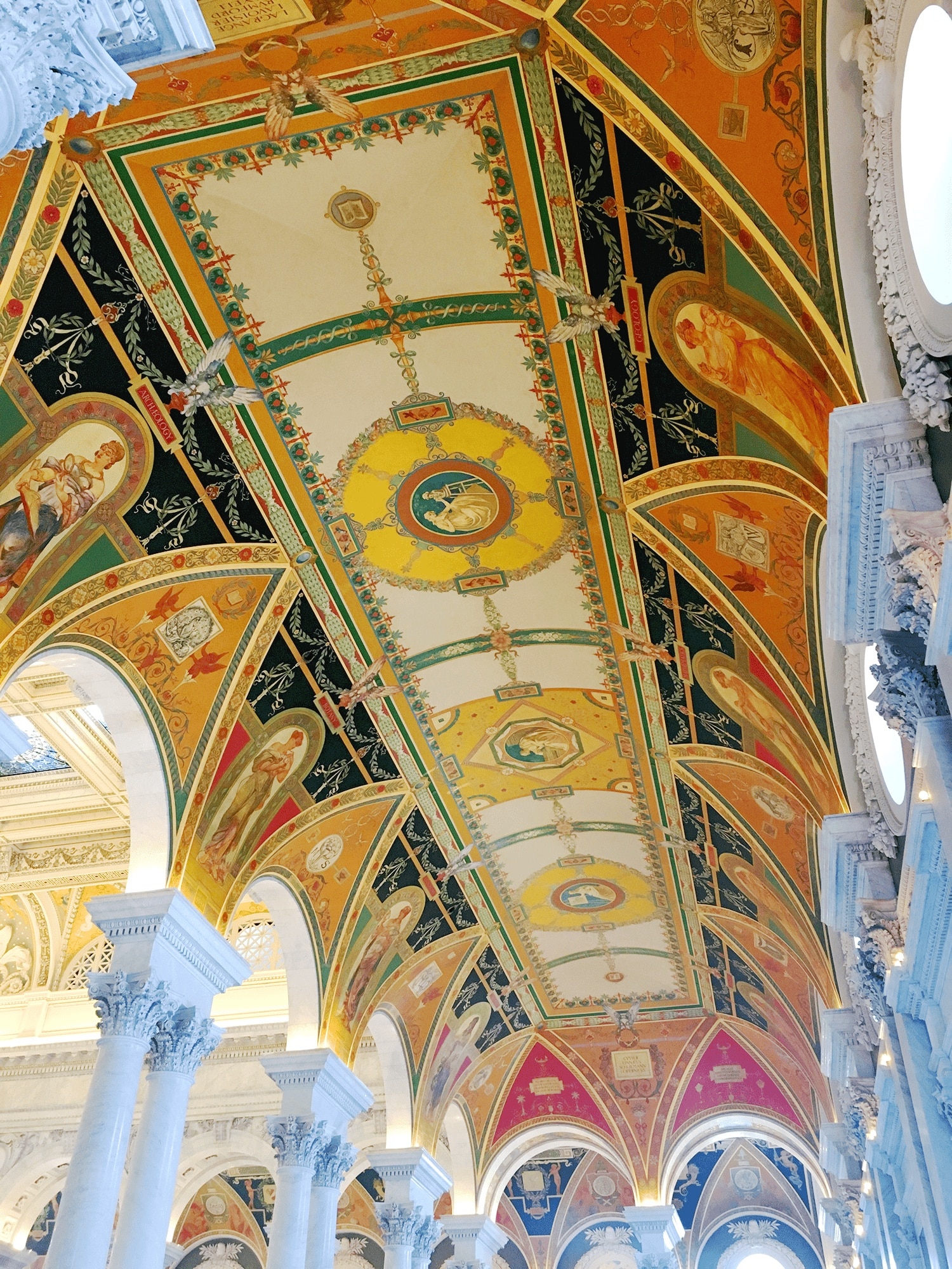 6-Day United States History Road Trip Itinerary Inspired by Hamilton the Musical 45 Ornate ceiling of the Library of Congress, featuring intricate frescoes, decorative arches, and gold detailing, exemplifying the grandeur seen during a tour in Washington DC.