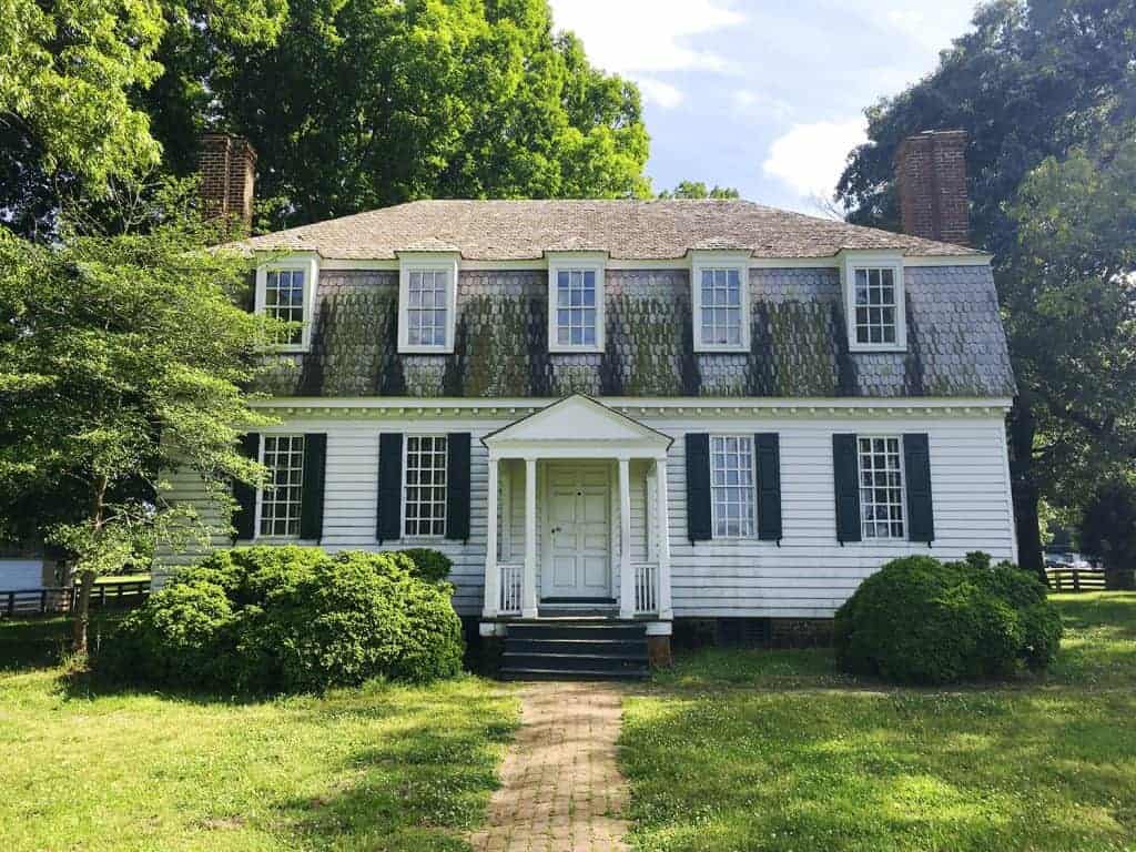 6-Day United States History Road Trip Itinerary Inspired by Hamilton the Musical 33 Moore House at the Yorktown Battlefield, a white colonial-style home with a gabled roof and green shutters, known as the site where surrender negotiations took place during the American Revolution.