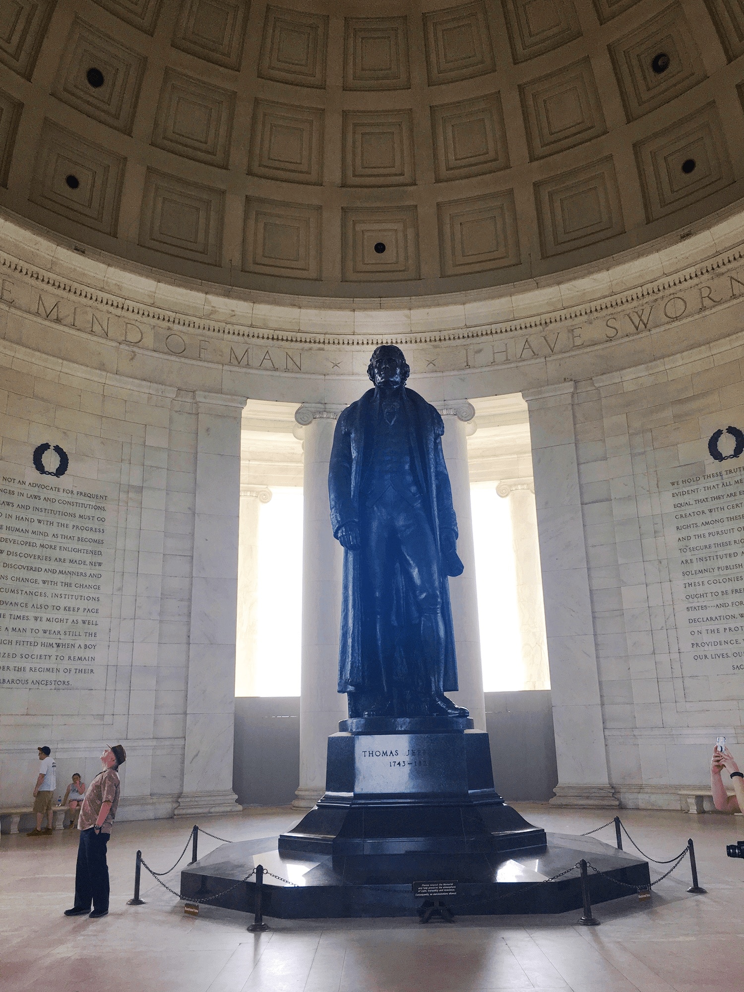 6-Day United States History Road Trip Itinerary Inspired by Hamilton the Musical 49 A 19‑foot bronze statue of Thomas Jefferson standing inside a classical domed rotunda with white marble columns, holding a copy of the Declaration of Independence in his left hand, under soft interior lighting in Washington DC.