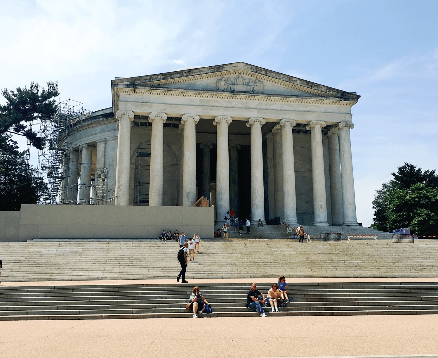 6-Day United States History Road Trip Itinerary Inspired by Hamilton the Musical 50 Jefferson Monument in Washington, D.C., featuring people sitting outside of the domed rotunda and white marble columns, a notable landmark on an American history tour.