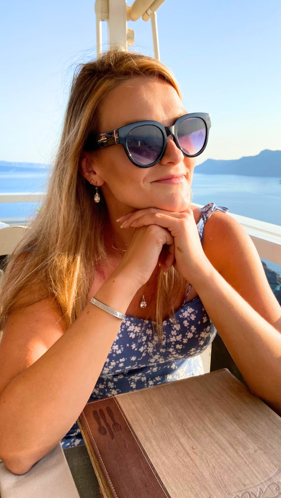 4-Day Santorini, Greece Itinerary: Simple Plan for Families on a Budget 2 woman sunglasses sea oia