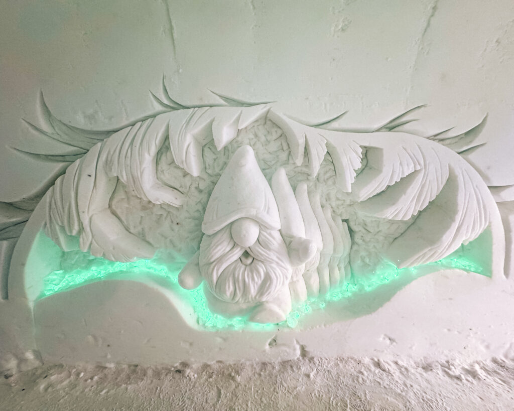 30 of the Best Things to Do in Rovaniemi, Finland, This Winter 60 Elf snow sculpture in Snowman World, perfect for winter wonderland enthusiasts.