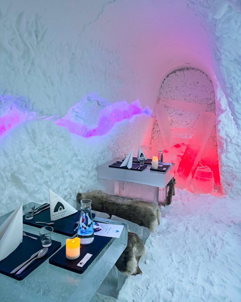 The Best Hotels in Rovaniemi, Finland: Comparing My Glass Igloo Stay with the City Center 38 Experience the Arctic SnowHotel Ice Restaurant, perfect for dining.