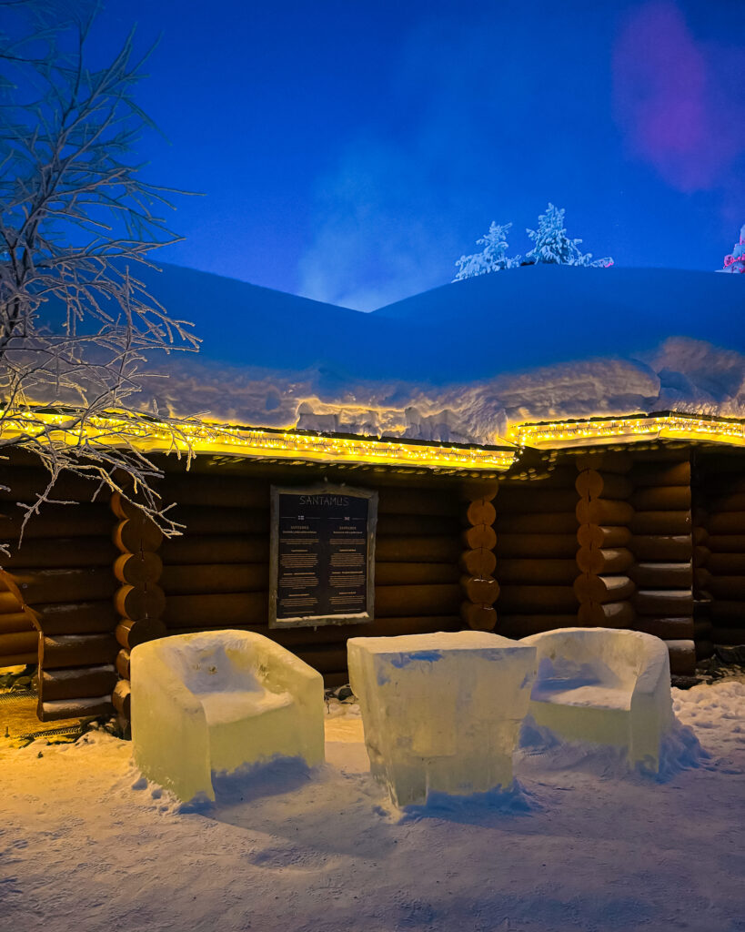 Is Rovaniemi, Finland, Worth Visiting? 19 Reasons You Should Visit in Winter 3 Festive ice chairs at Santas Village in Rovaniemi, ideal for a cozy holiday night.