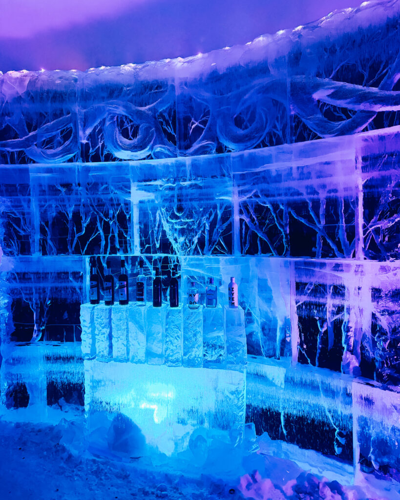 Is Rovaniemi, Finland, Worth Visiting? 19 Reasons You Should Visit in Winter 49 Ice bar at Snowman World in a snowy landscape.