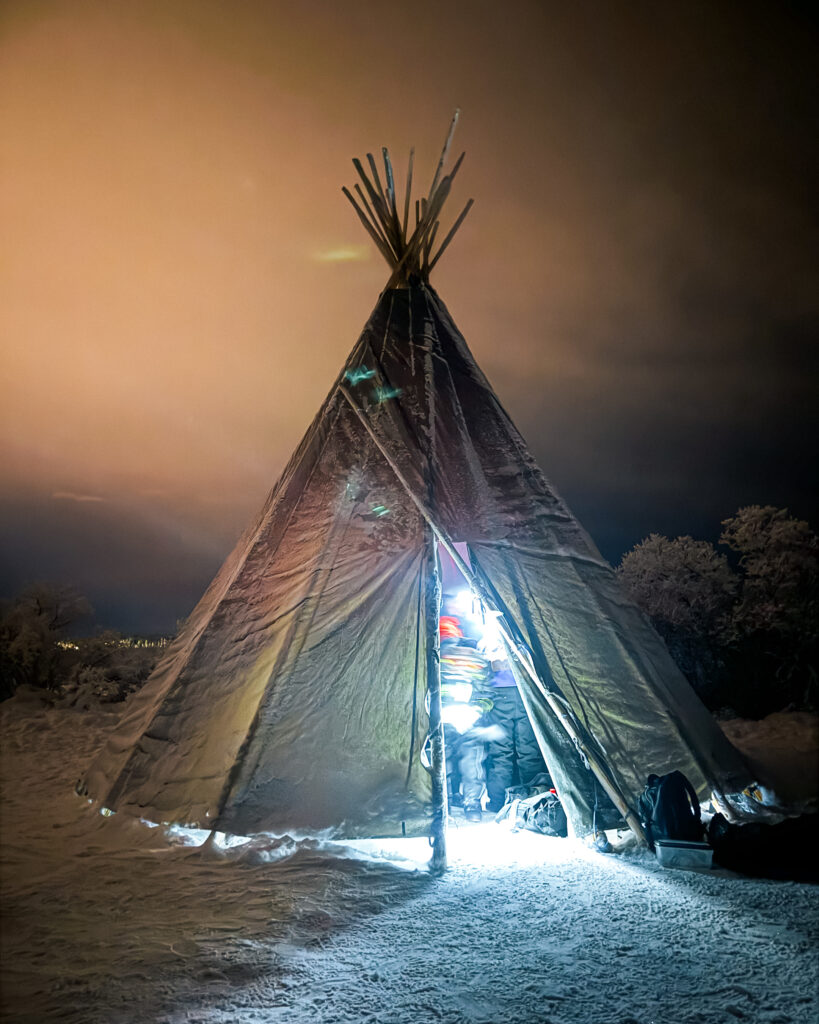 30 of the Best Things to Do in Rovaniemi, Finland, This Winter 31 Snowmobiling safari through Rovaniemi with teepee in snowy landscape.