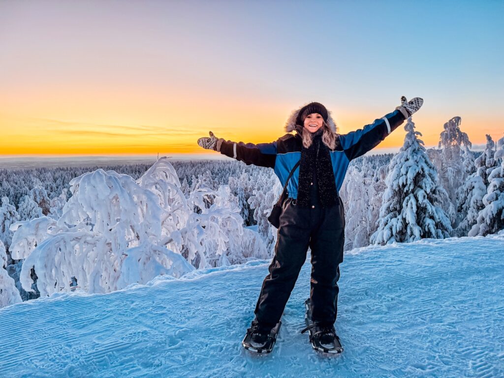 Is Rovaniemi, Finland, Worth Visiting? 19 Reasons You Should Visit in Winter 61 Hiking woman enjoying winter snowshoeing adventure in Rovaniemi.