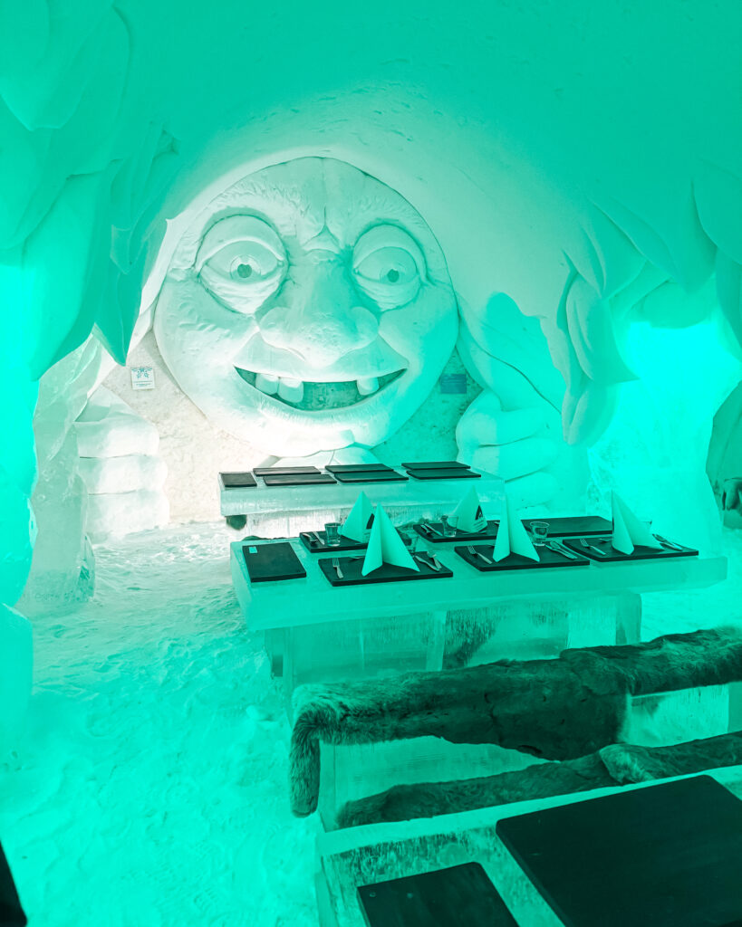 The Best Hotels in Rovaniemi, Finland: Comparing My Glass Igloo Stay with the City Center 33 Luxurious Arctic SnowHotel with Ice Restaurant and Green Troll sculpture.