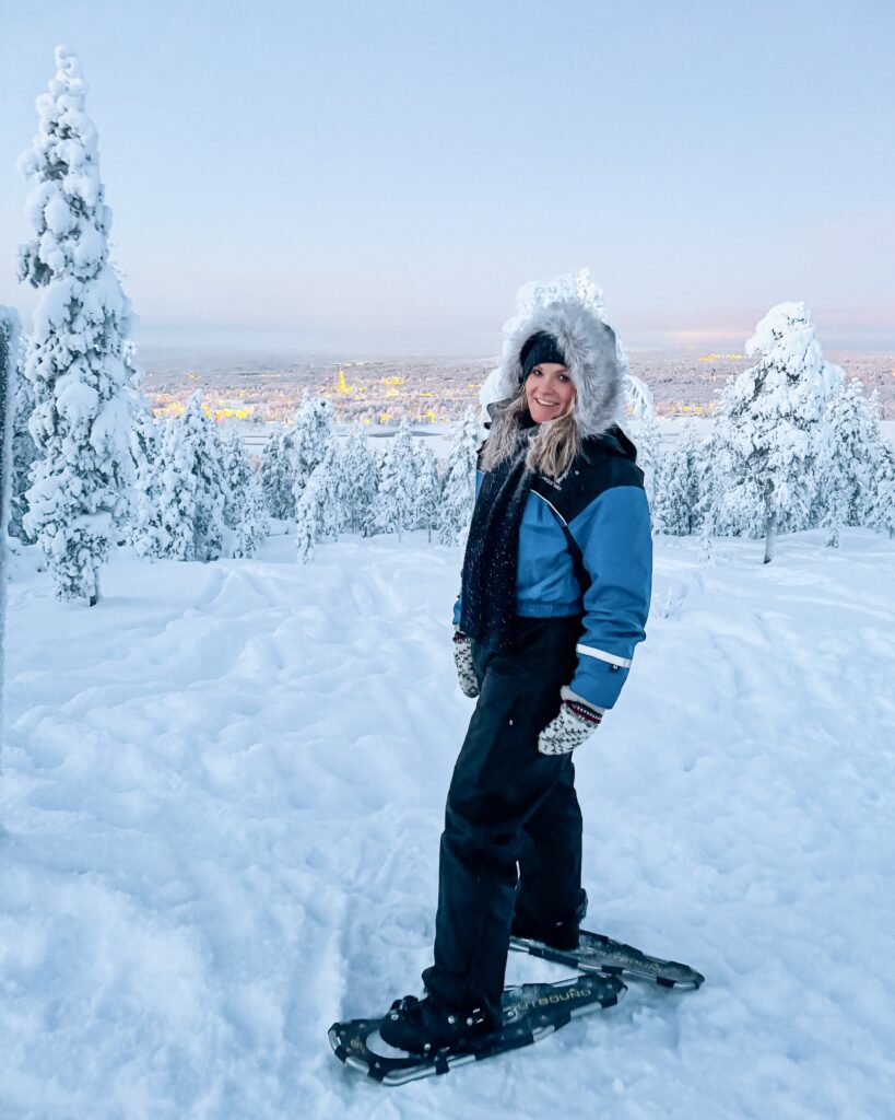 Is Rovaniemi, Finland, Worth Visiting? 19 Reasons You Should Visit in Winter 12 Woman enjoying winter hike and snowshoeing in Rovaniemi.
