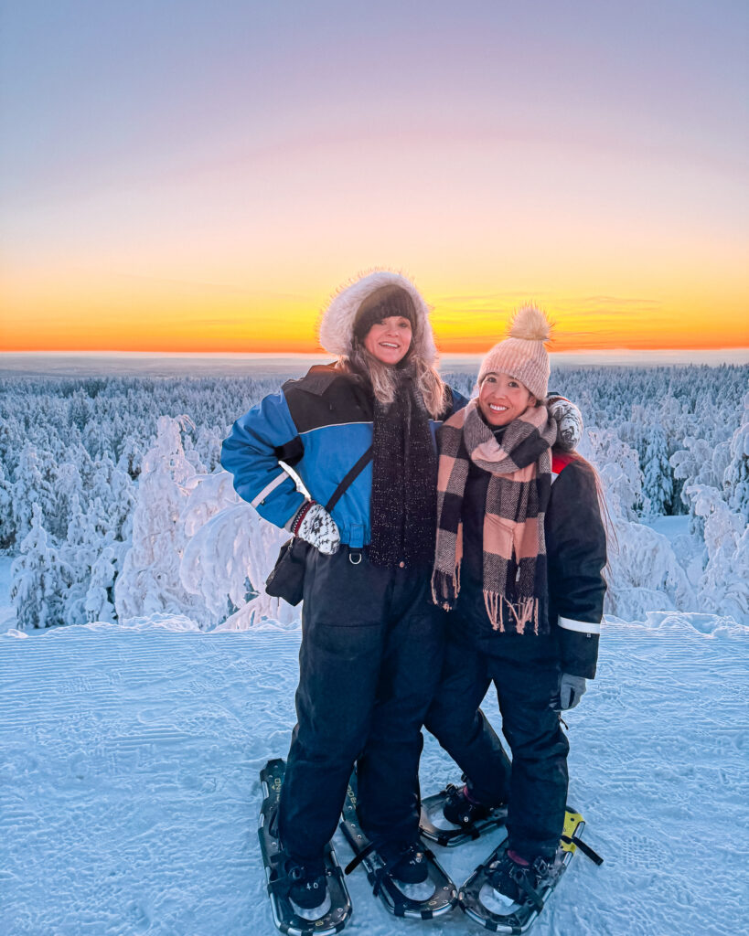 The Best Hotels in Rovaniemi, Finland: Comparing My Glass Igloo Stay with the City Center 62 Pair of women enjoying a hiking and snowshoeing adventure in Rovaniemi.