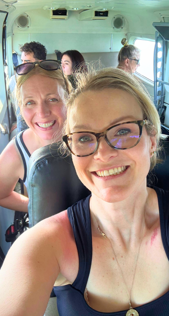 Ultimate Guide to Ambergris Caye, Belize, for First-Timers Visiting the Island 2 women aircraft belize