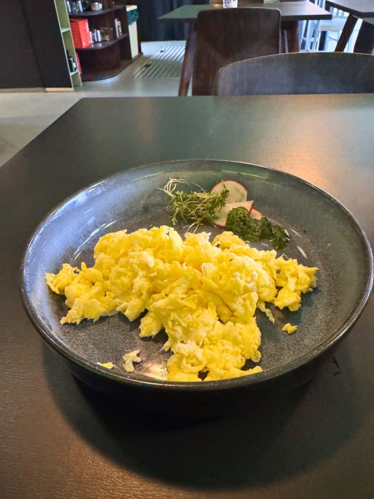Hüttenpalast Berlin: Reviewing This Caravan Hotel as a Solo Female Traveler 25 huttenpalast berlin scrambled eggs breakfast radish pesto
