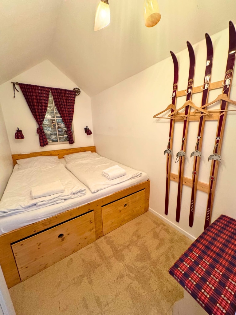 Hüttenpalast Berlin: Reviewing This Caravan Hotel as a Solo Female Traveler 9 huttenpalast berlin ski cabin vintage skis wall