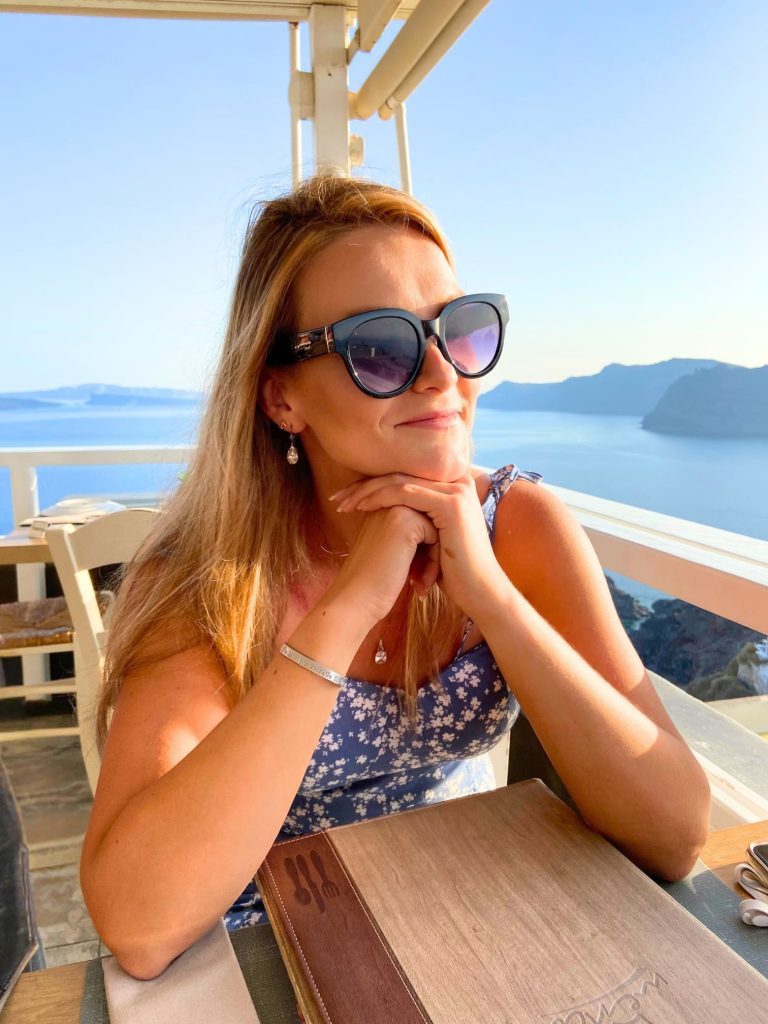 What to Wear in Greece: A Practical Packing List for Women 8 woman oia santorini sunglasses pelekanos restaurant