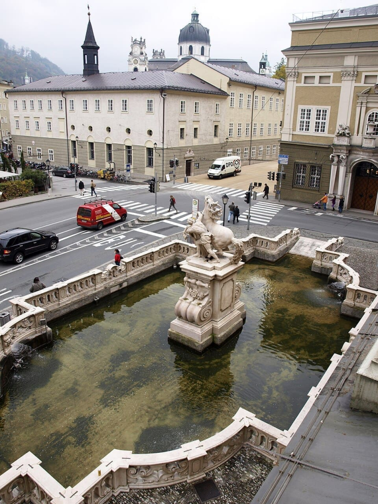 Top Things to Do in Salzburg, Austria: The Best Budget-Friendly, Walkable Attractions 39 pferdeschwemme horse pond kollegienkirche karajan platz salzburg austria