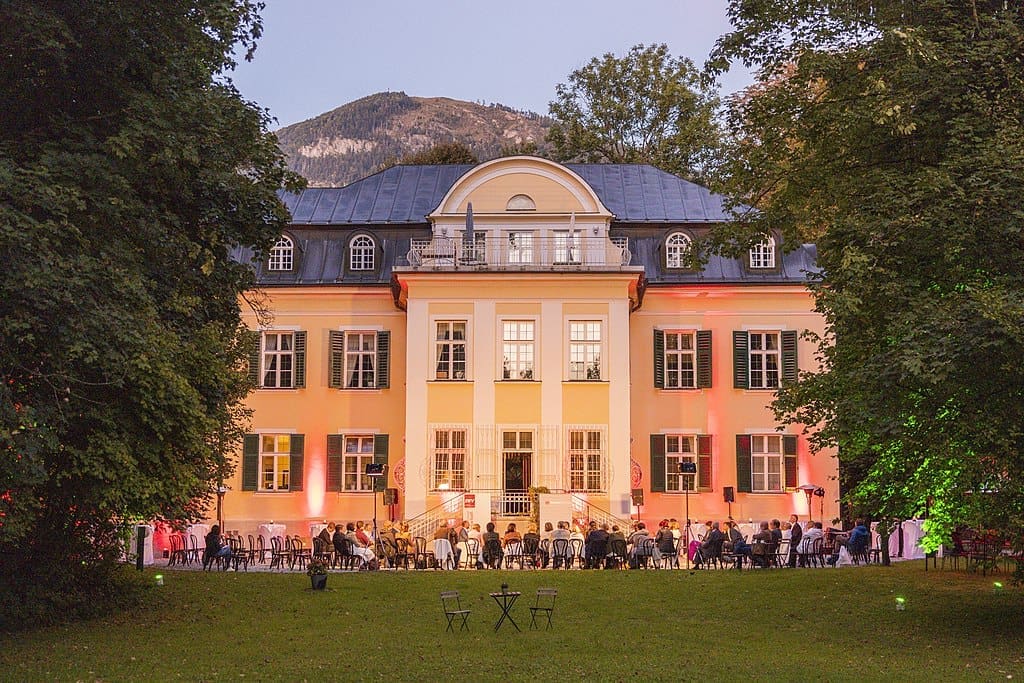 13 Sound of Music Filming Locations in Salzburg, Austria + How to Visit Them 45 villa trapp outdoor event lawn salzburg austria