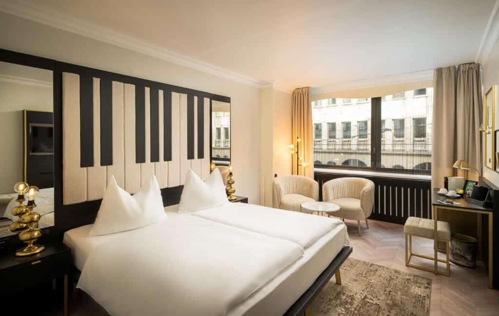 Where to Stay in Vienna, Austria: My Favorite Areas + Best Budget Hotels 17 elaya hotel vienna city center bedroom piano headboard vienna austria
