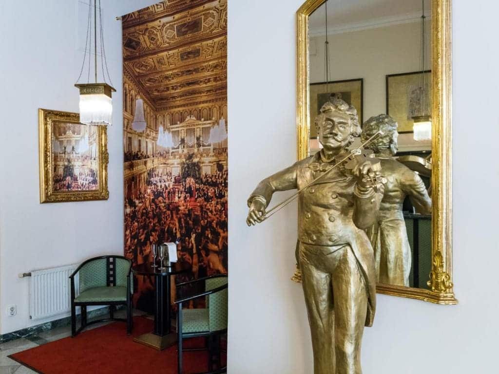 Where to Stay in Vienna, Austria: My Favorite Areas + Best Budget Hotels 75 hotel johann strauss lobby violinist statue vienna austria