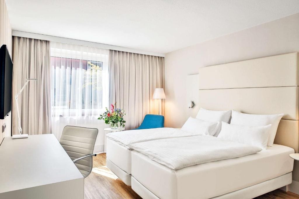 Where to Stay in Vienna, Austria: My Favorite Areas + Best Budget Hotels 112 hotel nh vienna airport bedroom cream headboard schwechat austria