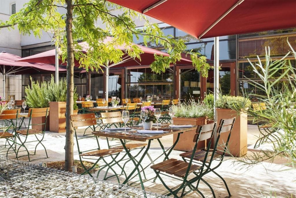 Where to Stay in Vienna, Austria: My Favorite Areas + Best Budget Hotels 111 hotel nh vienna airport outdoor terrace dining schwechat austria