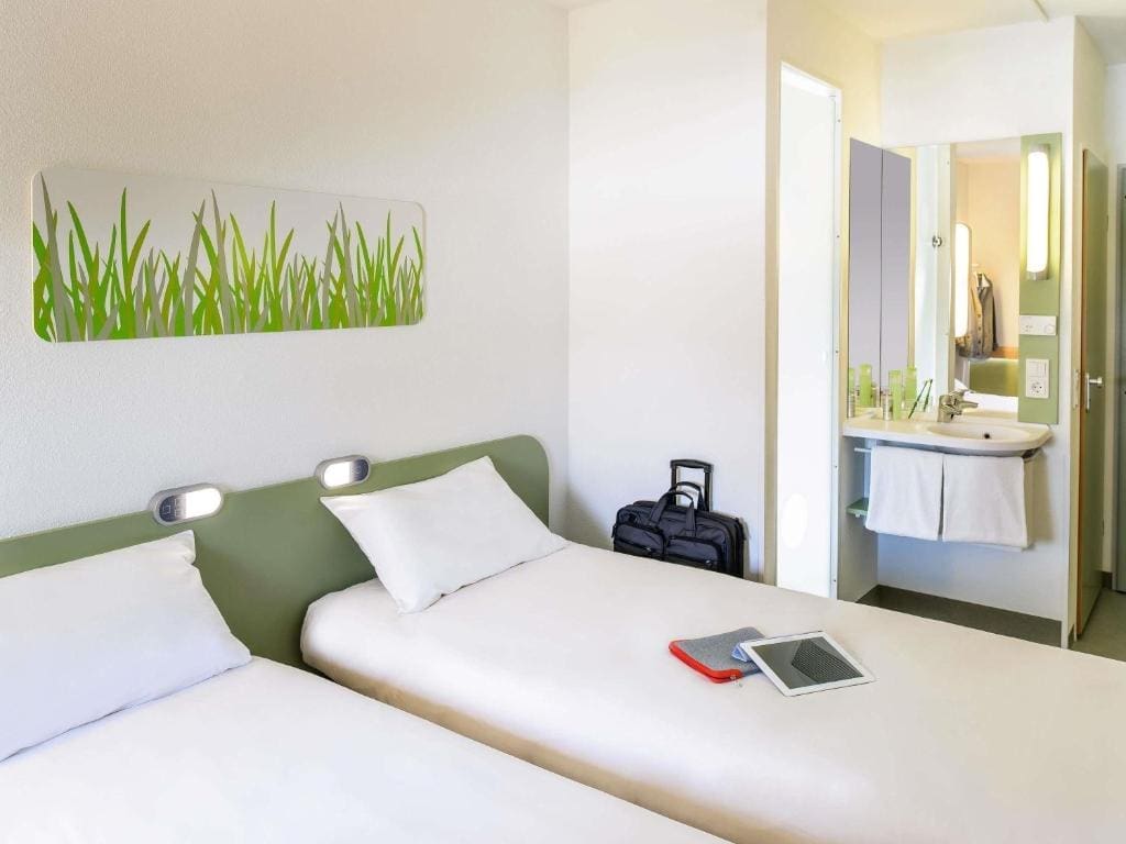 Where to Stay in Vienna, Austria: My Favorite Areas + Best Budget Hotels 56 ibis budget wien messe twin room green headboards vienna austria