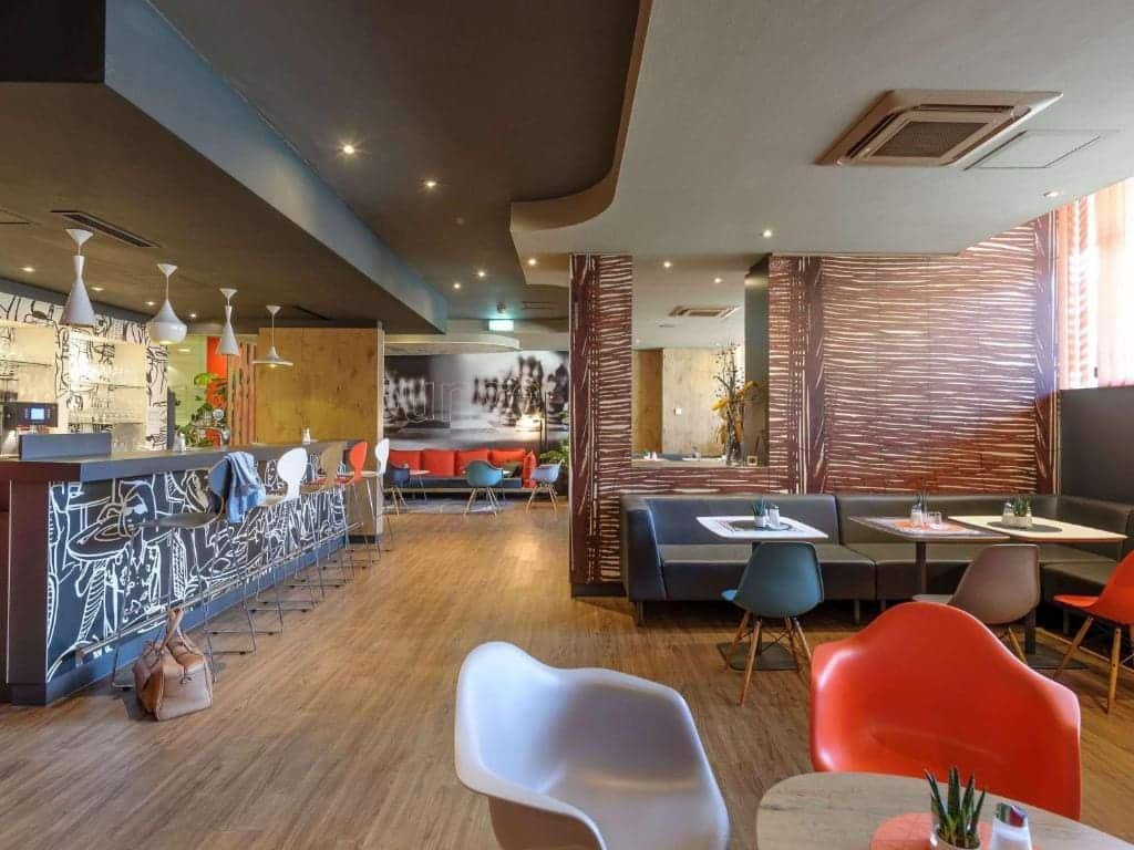 Where to Stay in Vienna, Austria: My Favorite Areas + Best Budget Hotels 63 ibis wien mariahilf bar lounge graphic mural vienna austria
