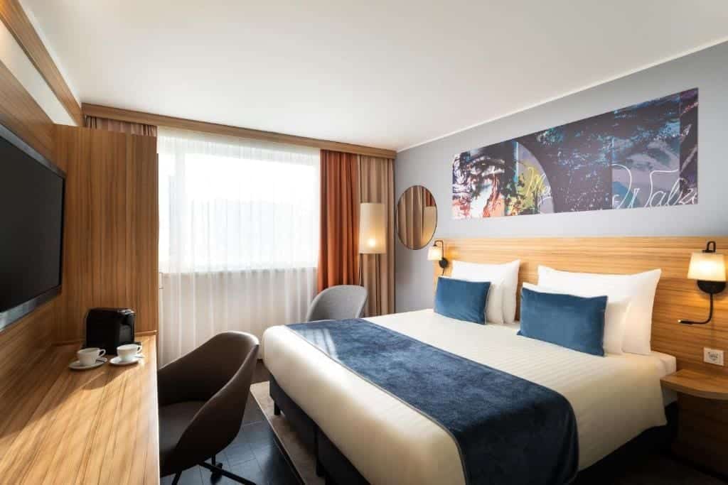 Where to Stay in Vienna, Austria: My Favorite Areas + Best Budget Hotels 82 leonardo hotel vienna schonbrunn bedroom navy pillows vienna austria
