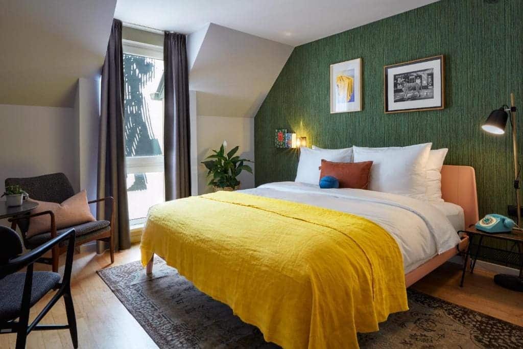 Where to Stay in Vienna, Austria: My Favorite Areas + Best Budget Hotels 46 max brown 7th district hotel bedroom green wallpaper vienna austria