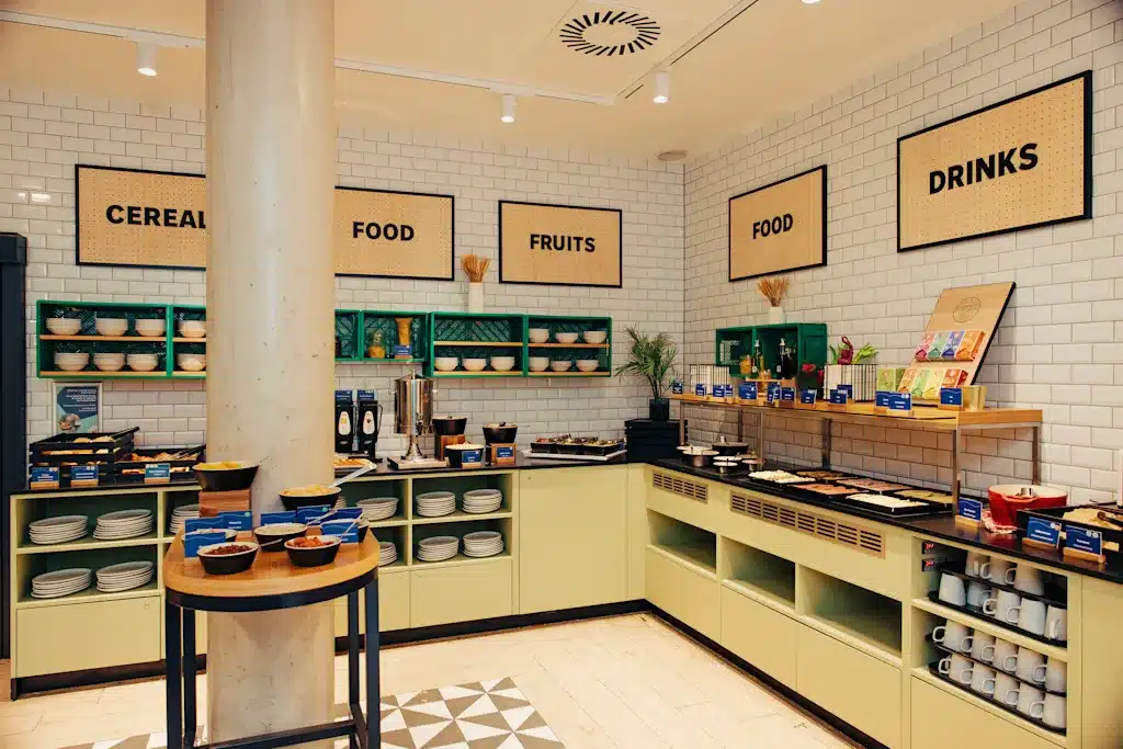 Where to Stay in Vienna, Austria: My Favorite Areas + Best Budget Hotels 50 meininger hotel vienna downtown franz breakfast station signage vienna austria