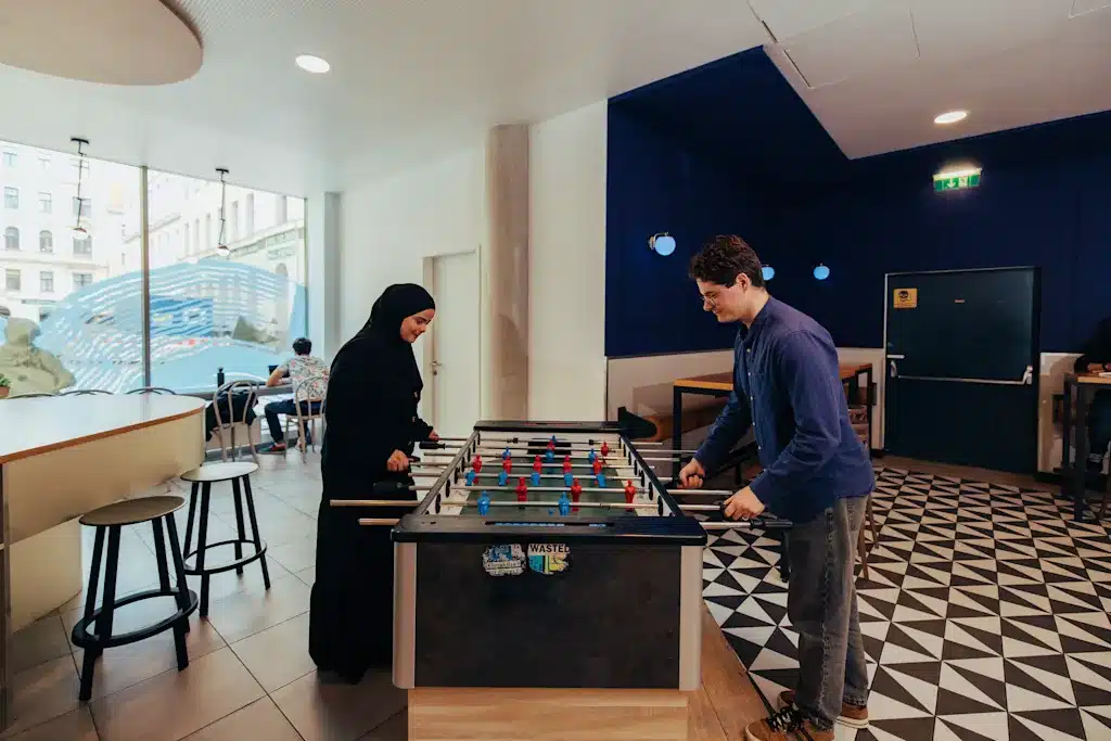 Where to Stay in Vienna, Austria: My Favorite Areas + Best Budget Hotels 52 meininger hotel vienna downtown franz common area foosball vienna austria
