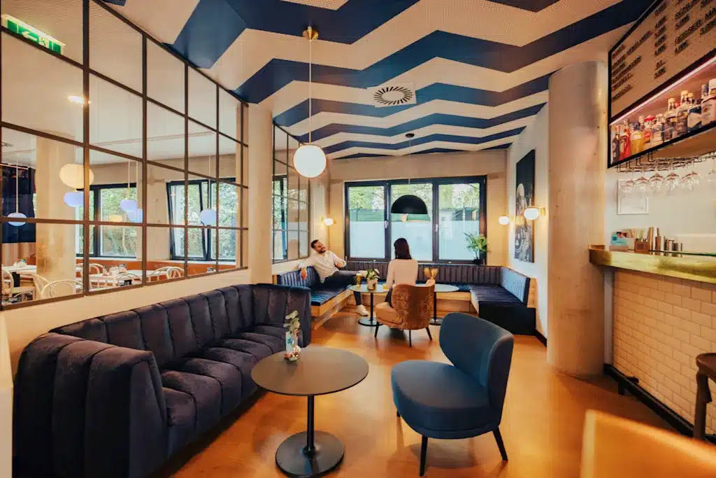 Where to Stay in Vienna, Austria: My Favorite Areas + Best Budget Hotels 48 meininger hotel vienna downtown franz lounge chevron ceiling vienna austria