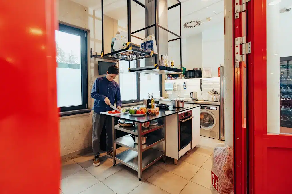 Where to Stay in Vienna, Austria: My Favorite Areas + Best Budget Hotels 51 meininger hotel vienna downtown franz shared kitchen guest cooking vienna austria