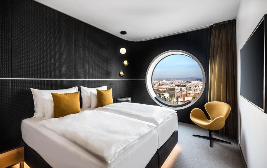 Where to Stay in Vienna, Austria: My Favorite Areas + Best Budget Hotels 97 mooons hotel vienna bedroom porthole window vienna austria