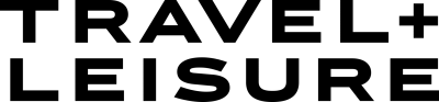 Home 19 Travel + Leisure logo in bold black text with a modern sans-serif font.